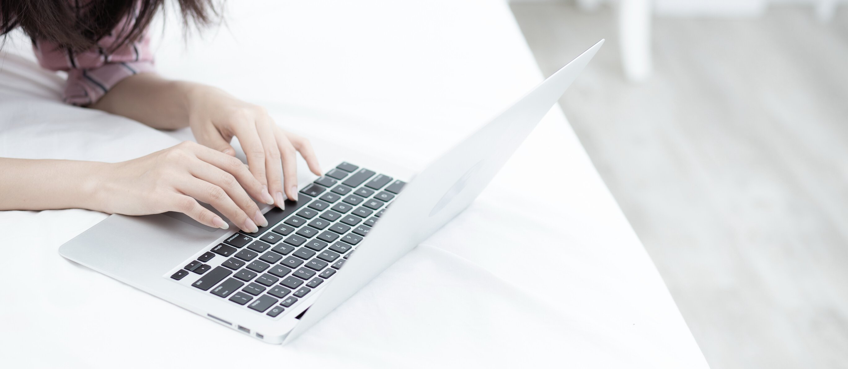 Woman with Laptop Working Online